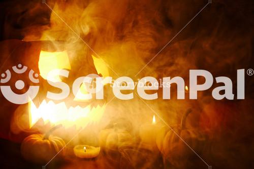 Scary Jack O Lantern And Halloween Lights In Mist